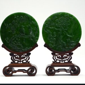 Chinese green jade carved plaques, $25,000