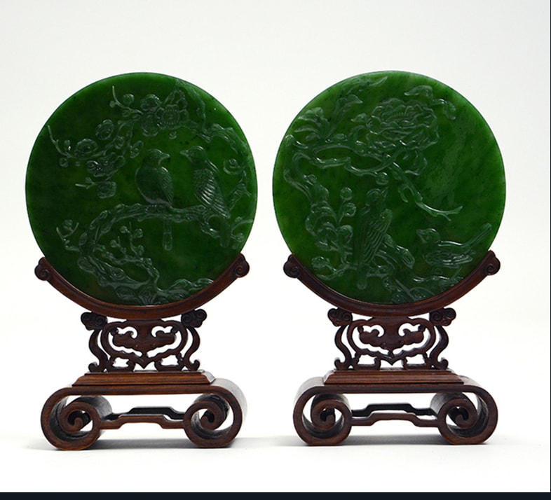 Chinese green jade carved plaques, $25,000