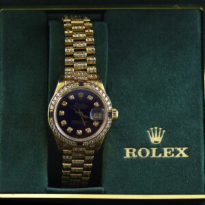 18k yellow gold and diamond ladies Oyster Perpetual Datejust Rolex 26 mm watch with diamond and sapphire