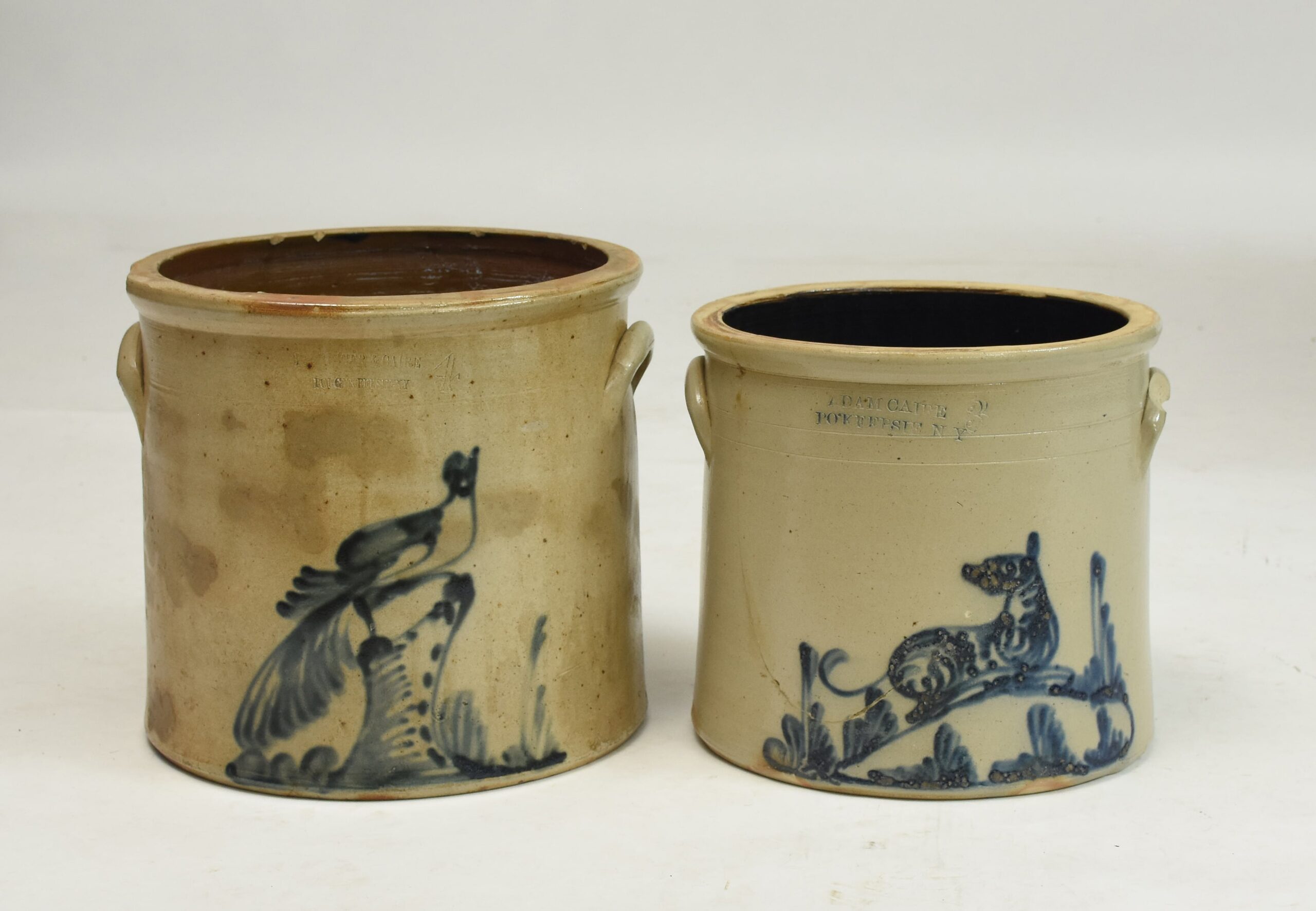 Two stoneware crocks, bird on stump, dog, Poughkeepsie NY by Caire